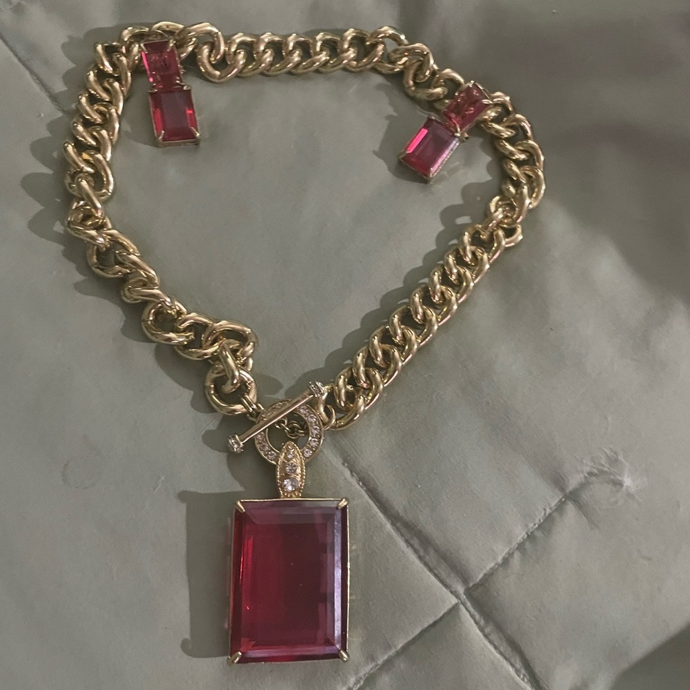 Necklace and earrings. Heidi Daus . Hot rocks in pick . With box